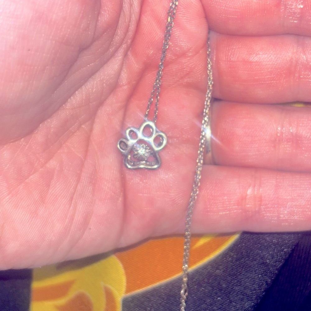 925 silver paw necklace with MASSIVE genuine diamond in center that sparkles